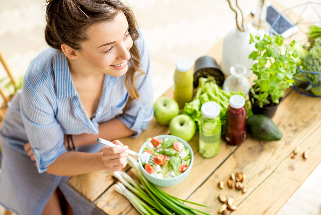 woman eating salad